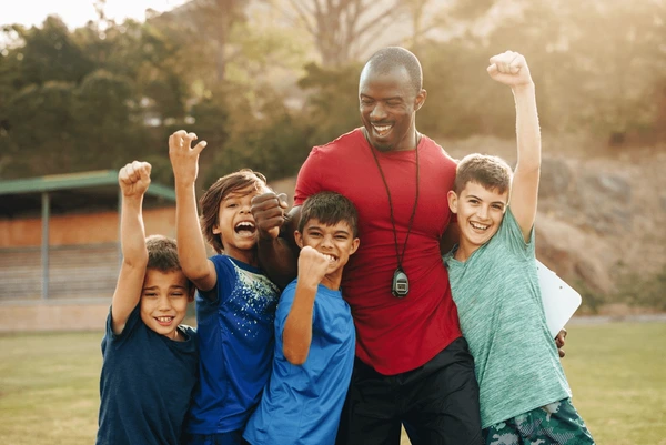 school-kids-celebrating-their-coach-600nw-2229908557
